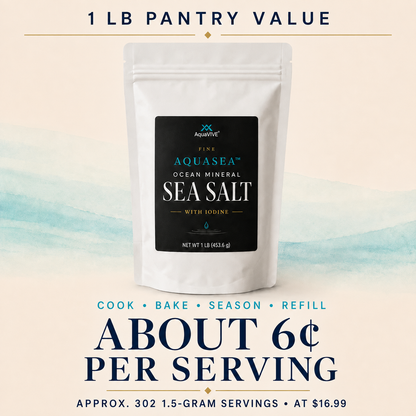 A white stand-up pouch of AquaVie Fine Aquassea Ocean Mineral Sea Salt with a black label, centered on a cream background with blue watercolor wash and promotional text reading '1 LB PANTRY VALUE' and 'ABOUT 6C PER SERVING'.