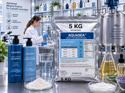AQUASEA Ocean Trace Mineral Powder 5 kg bag displayed in a commercial cosmetic formulation laboratory with shampoo, conditioner, botanical ingredients, laboratory glassware, and stainless steel mixing equipment.