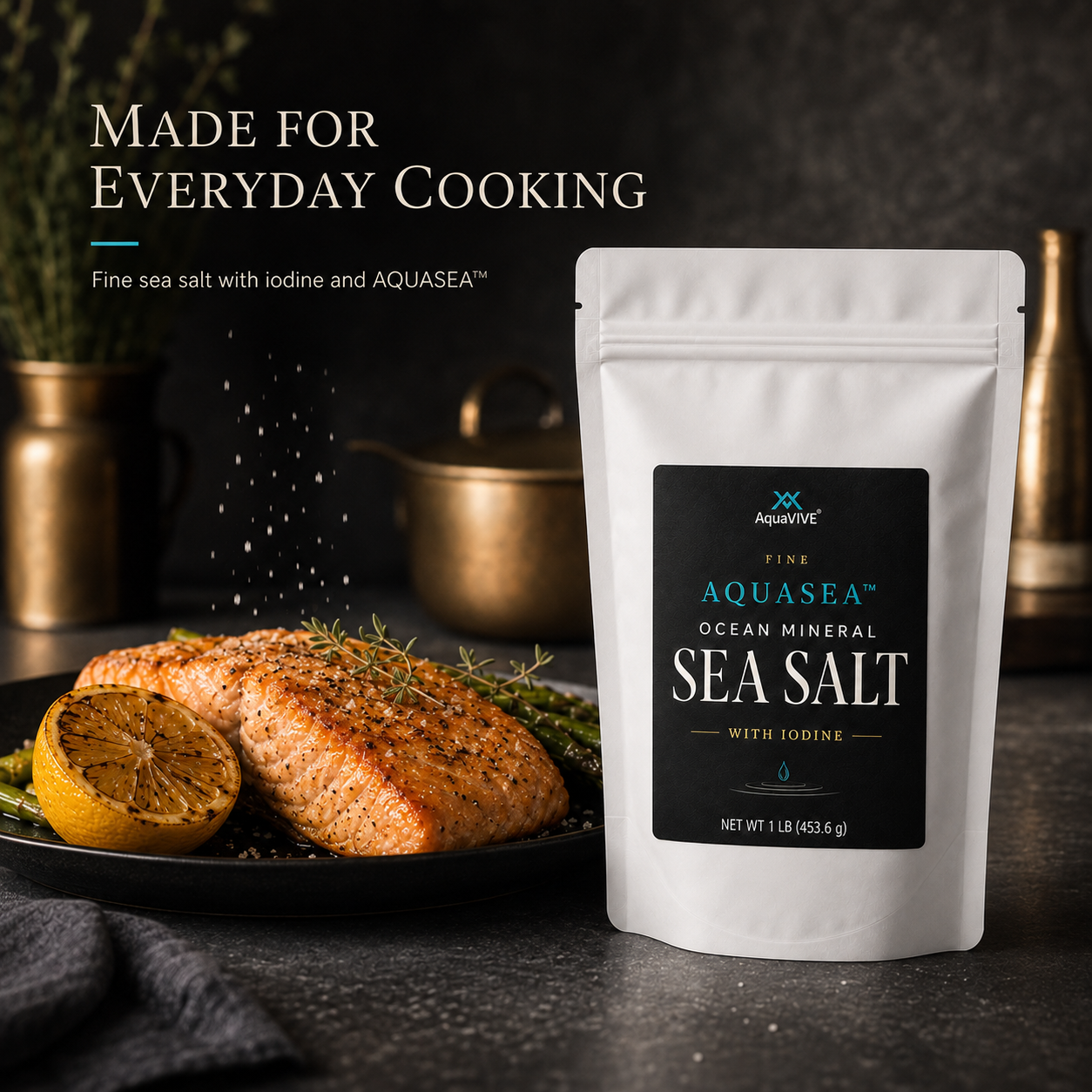 AquaVIVE Fine AQUASEA™ Sea Salt 1 lb pouch beside seasoned salmon and grilled lemon.